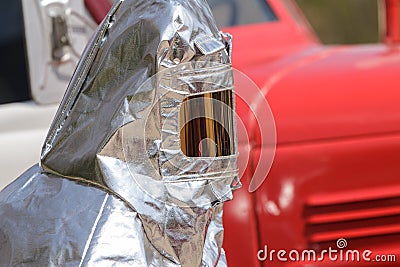 Fire in special heat resistant suit Stock Photo