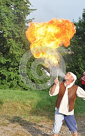 Fire spitting juggler Editorial Stock Photo