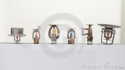 Fire sprinkler heads with fusible links and frangible bulbs Stock Photo