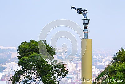 Fire sprinkler with a nozzle valve incorporated. An heavy-duty part of the fire protection system of forest or park green Stock Photo