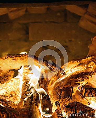 Fire in the stove burns firewood heat hearth close-up Stock Photo