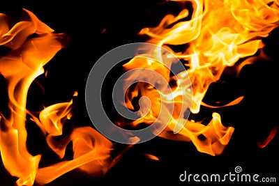 Fire tongues of red flame on a black background. Fire flame in the night Stock Photo