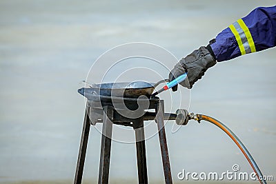 fire trainer hand,how to ignite or light gas at stove for conflagration preventive extinguish training, safety concept Stock Photo