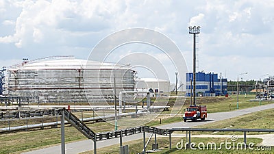 Fire truck in industrial plant. A large red fire rescue vehicle in the chemistry refinary plant. Fire safety concept Stock Photo