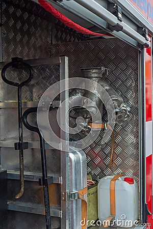 A fire truck with open hatches demonstrating rescue equipment Stock Photo