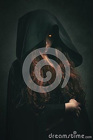 Fire witch with black robe Stock Photo