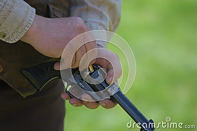 Reenactor loads replica gun Stock Photo