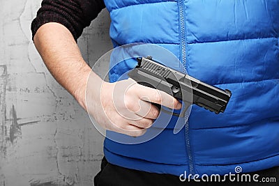 Firearms for self-defense. Black pistol in male hand Stock Photo