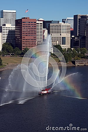 Fireboat in front of marina, city. Stock Photo