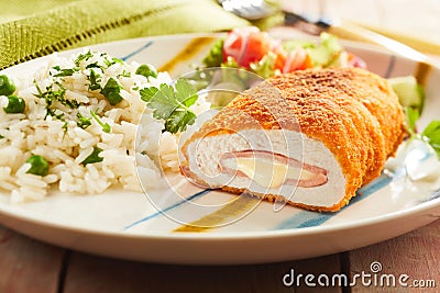 Cordon bleu chicken with rice and parsley Stock Photo