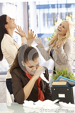 Fired employee crying at desk Stock Photo