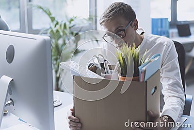 Fired office worker leaving the office Stock Photo