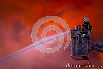 Firefighter in action Stock Photo