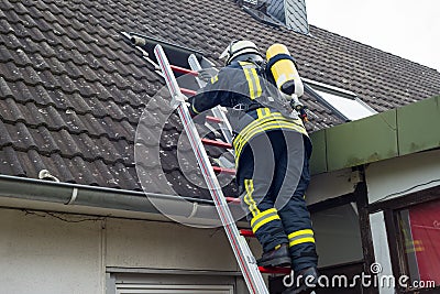 Firefighter in action and extinguish apartment fire - Serie Firefighter Stock Photo