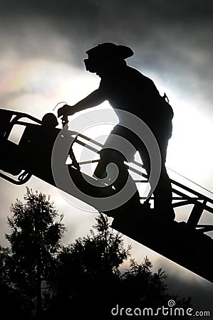 Firefighter on ladder Stock Photo