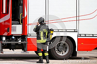 Firefighter with oxygen tank in action 1 Editorial Stock Photo