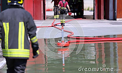 Firefighter positions a powerful fire hydrant during the exercises Stock Photo