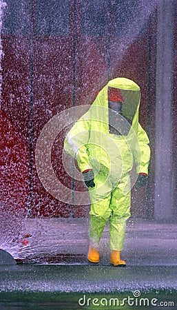 Firefighter protective yellow jumpsuit with for protection from Stock Photo