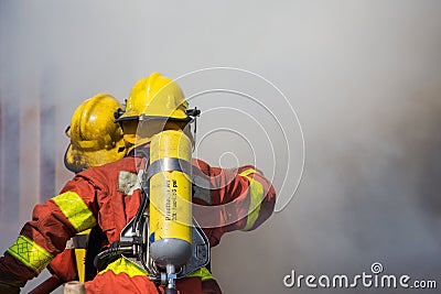 Firefighter and rescue team surround with smoke and dust Stock Photo