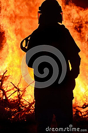 Firefighter rescue worker at scene rural bushfire Stock Photo