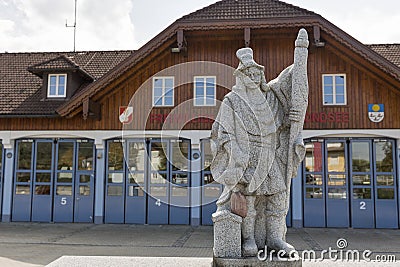 Firefighter statue in front of fire department. Mondsee, Austria. Stock Photo