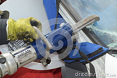 Firefighter using jaws of life Editorial Stock Photo