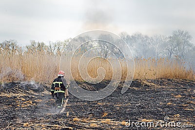 Firefighters battle a wildfire. firefighters spray water to wildfire. Australia bushfires, The fire is fueled by wind and heat Stock Photo