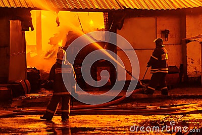 Firefighters extinguish a fire Stock Photo