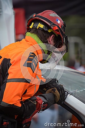 Firefighters extricating a car during training Editorial Stock Photo