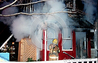 Firefighters fight a house fire in Greenbelt, Maryland Stock Photo