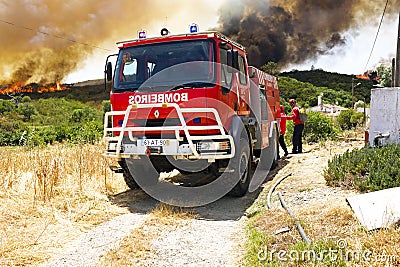 Firefighters fighting a huge bushfire in Portugal Editorial Stock Photo