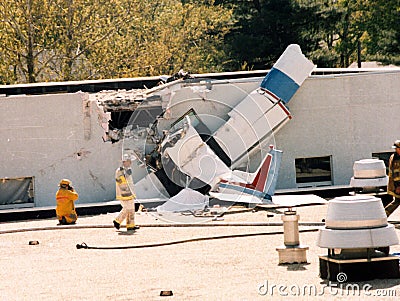 Firefighters investigate a plane crash Editorial Stock Photo