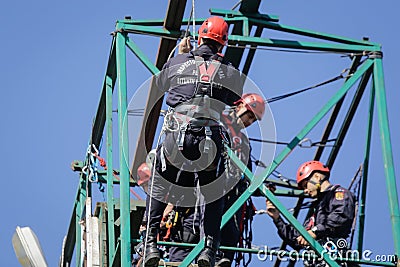 Firefighters are rappelling and climbing ropes Editorial Stock Photo