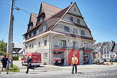 Firefighters rush to respond to emergency call during Corpus Christi procession. Editorial Stock Photo