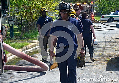 Firefighters prepare to clean up after putting a fire out in Hyattsville, Maryland Editorial Stock Photo