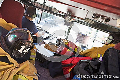 Firefighters travelling to an emergency Stock Photo