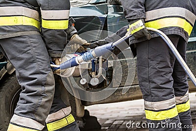 Firefighters working on an auto vehicle extrication Stock Photo