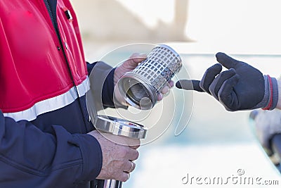 Firefighters working with a suction pump Stock Photo