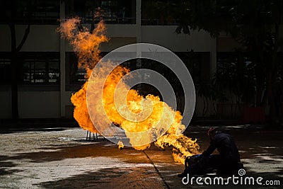 Fireman demonstrates how to suppress fire from gas tanks Stock Photo