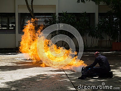 Fireman demonstrates how to suppress fire from gas tanks Stock Photo