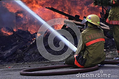 Fireman with hose Editorial Stock Photo