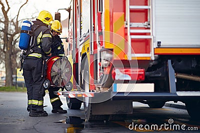 Fireman pack equipment on the fire truck.firefighter successfully completed the firefighting Stock Photo