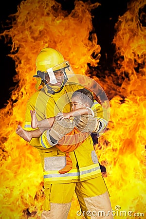 Fireman rescued the child from the fire Stock Photo
