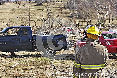 Fireman surveying tornado damage. Editorial Stock Photo