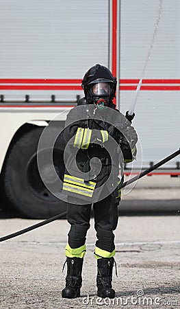 Fireman uses a fire extinguisher to extinguish a fire Editorial Stock Photo