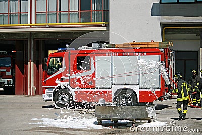 Firemen extinguish a simulated fire during an exercise in their Editorial Stock Photo