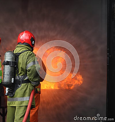 Firemen fighting the fire Stock Photo