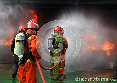 Firemen fighting the fire Stock Photo