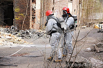 Firemen in light protective suit Editorial Stock Photo