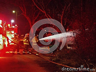 Firemen with Water Hose at House Fire Editorial Stock Photo